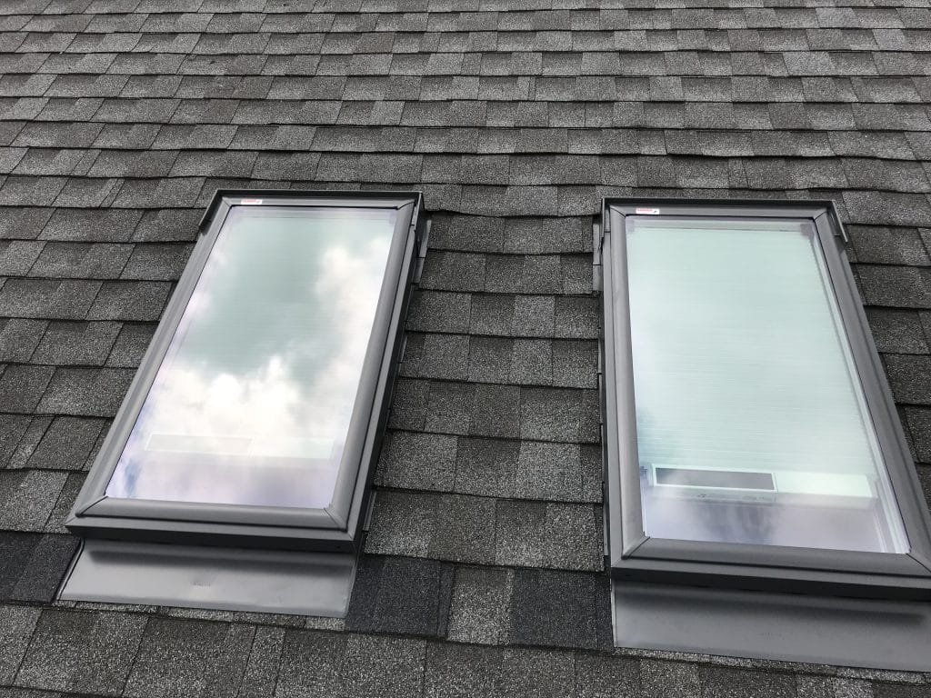 Two VELUX skylights installed side by side on a roof by Wisconsin Sunlight Solutions.
