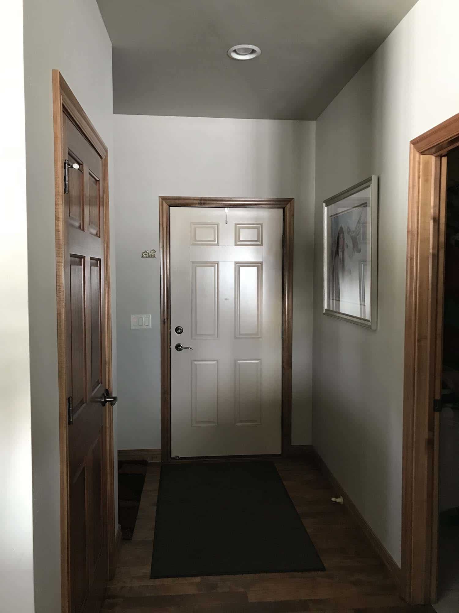 A photo of a home's dark entryway before a VELUX skylight installation by Wisconsin Sunlight Solutions.
