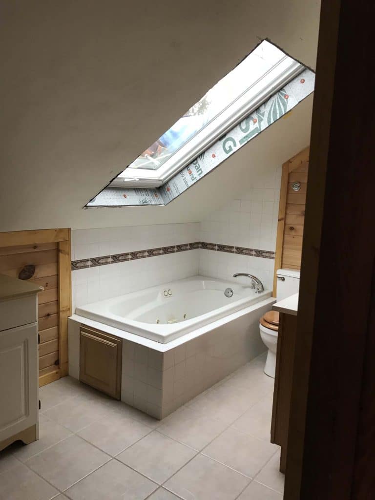 Milwaukee VELUX Skylight over a bathtub being installed by Wisconsin Sunlight Solutions.